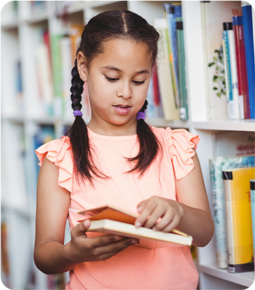 Smiling child holding stuffed animals