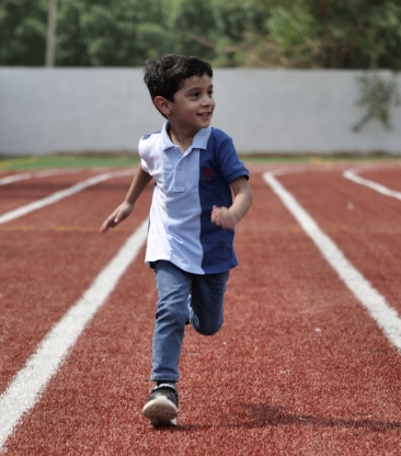 Smiling child holding stuffed animals